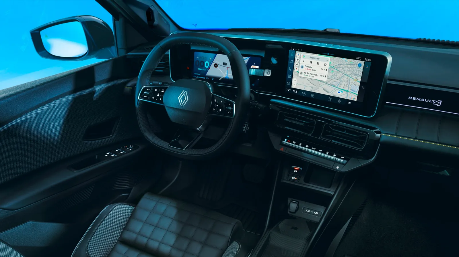 Dashboard van de Renault 4 E-Tech electric met twee schermen en gewatteerde stoel
