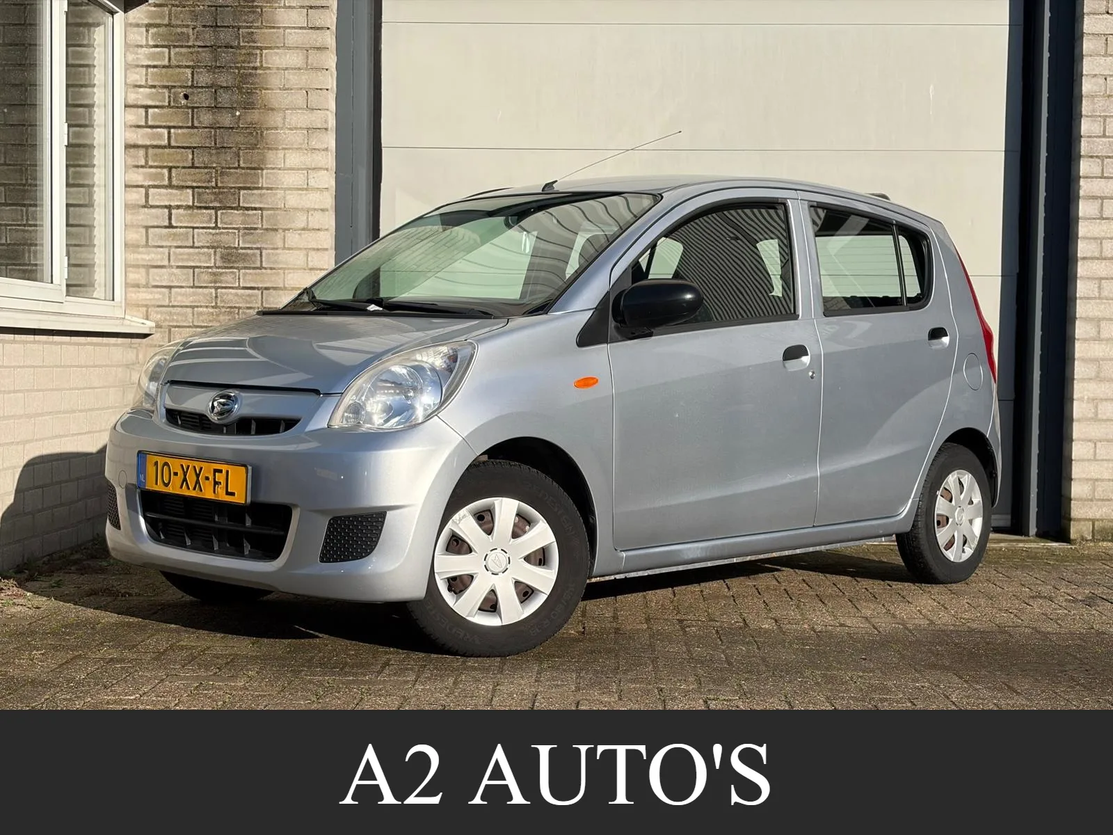 Daihatsu Cuore (2007) — foto 1