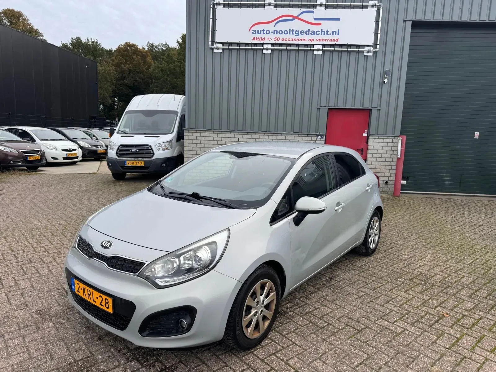 Kia Rio (2013) — foto 1