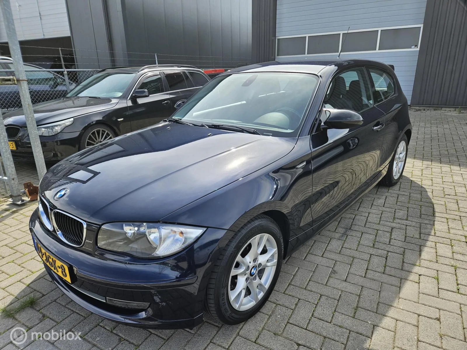 BMW 1-Serie (2009) — foto 1