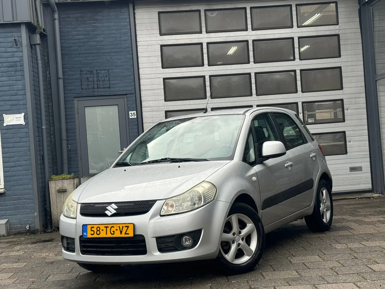 Suzuki SX4 (2006) — foto 1