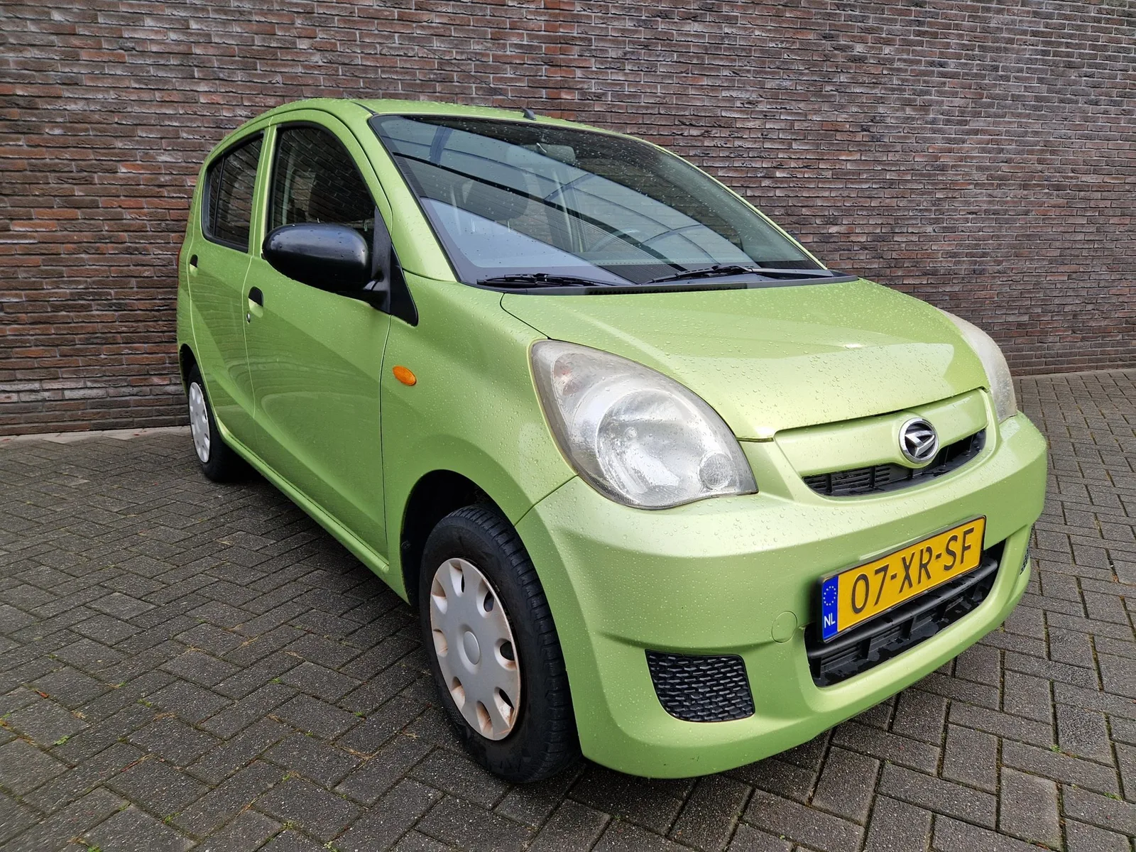 Daihatsu Cuore (2007) — foto 1
