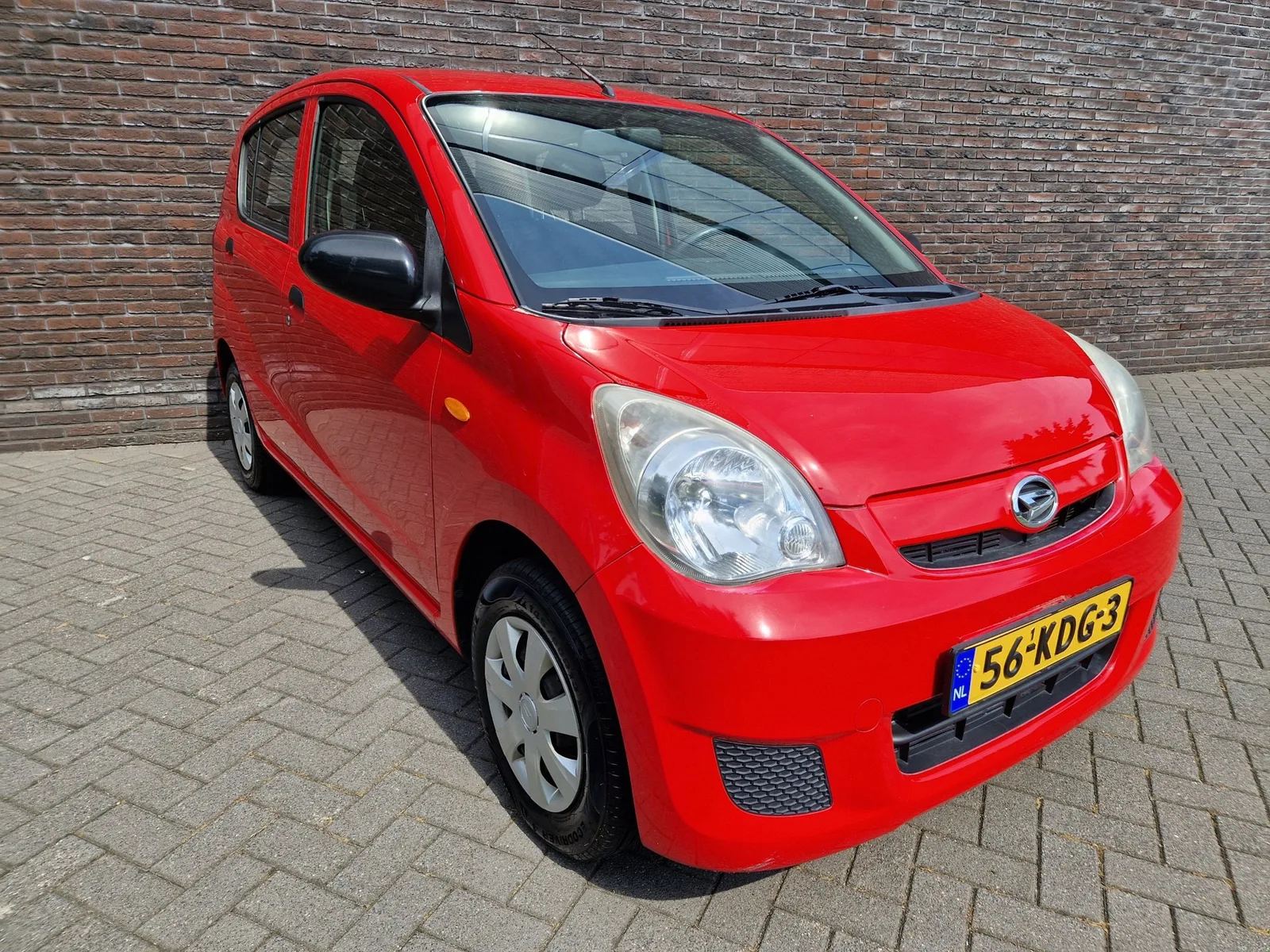 Daihatsu Cuore (2009) — foto 1