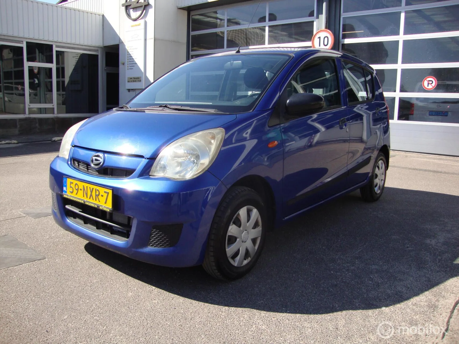Daihatsu Cuore (2011) — foto 1
