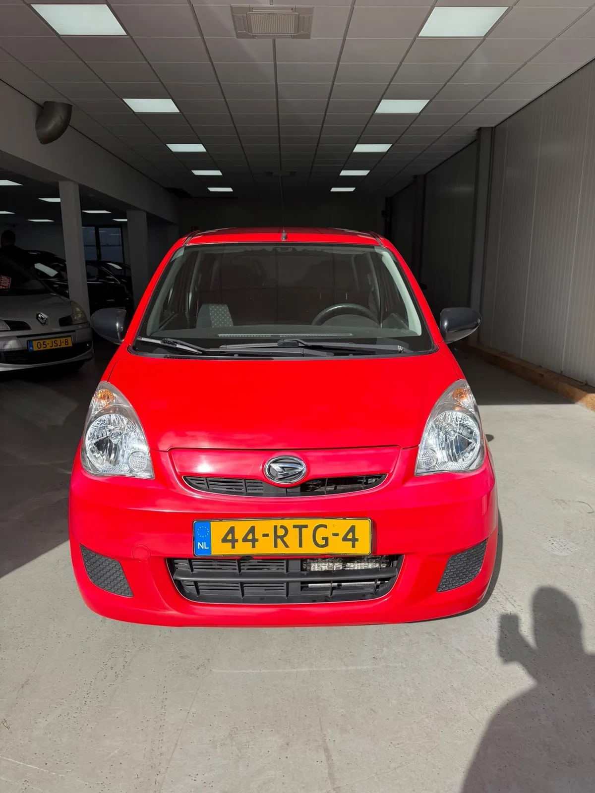Daihatsu Cuore (2011) — foto 1