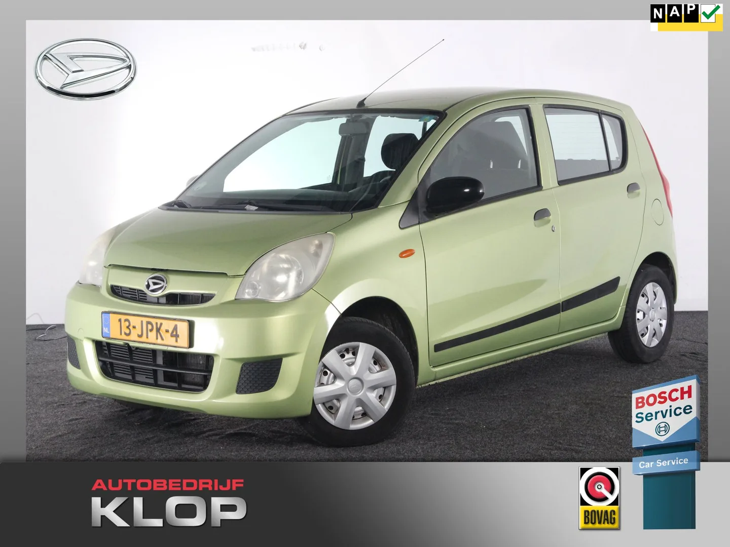 Daihatsu Cuore (2009) — foto 1