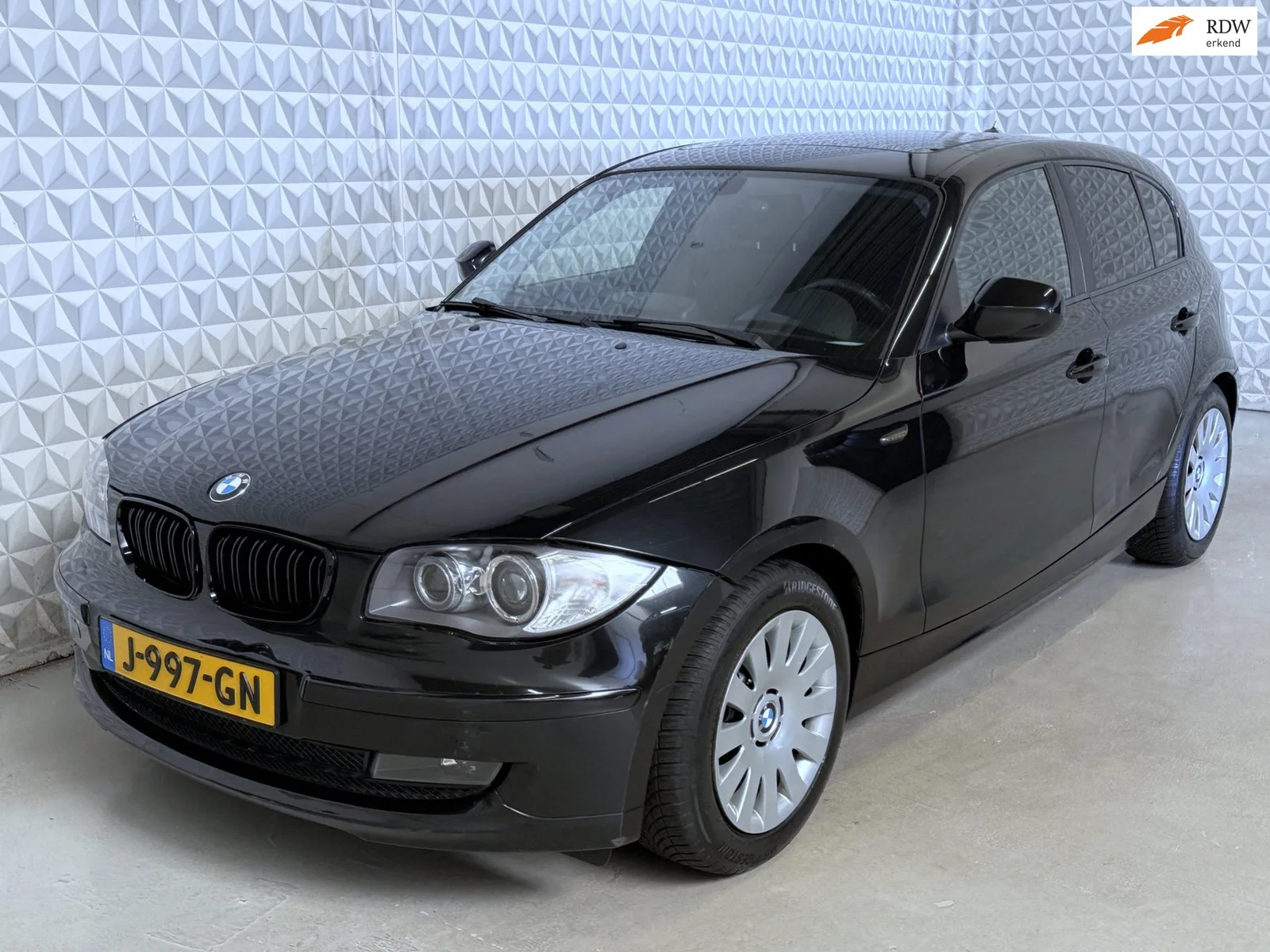 BMW 1-Serie (2009) — foto 1