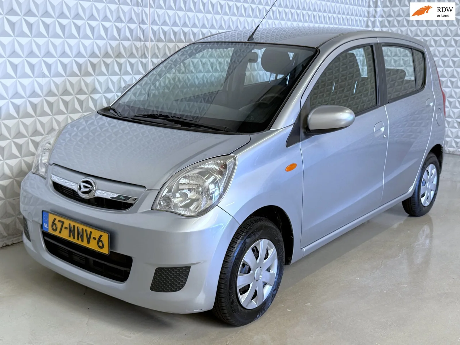 Daihatsu Cuore (2010) — foto 1