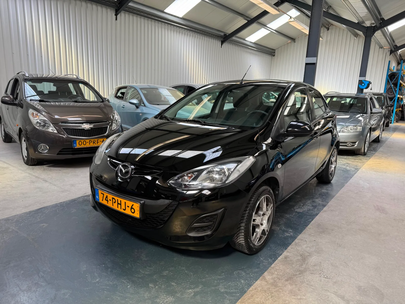 Mazda 2 (2011) — foto 1