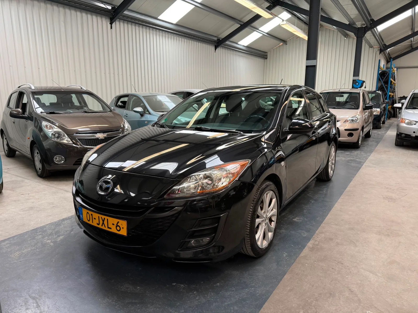 Mazda 3 (2009) — foto 1