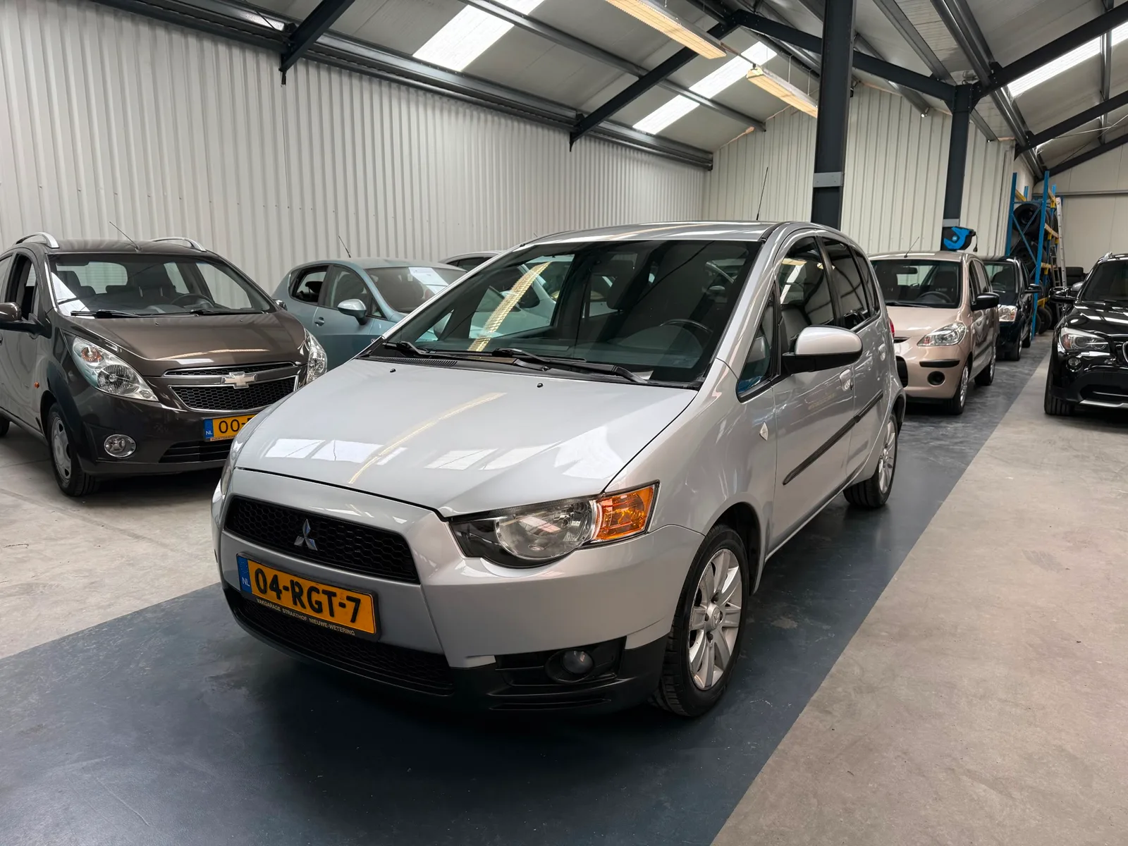 Mitsubishi Colt (2011) — foto 1