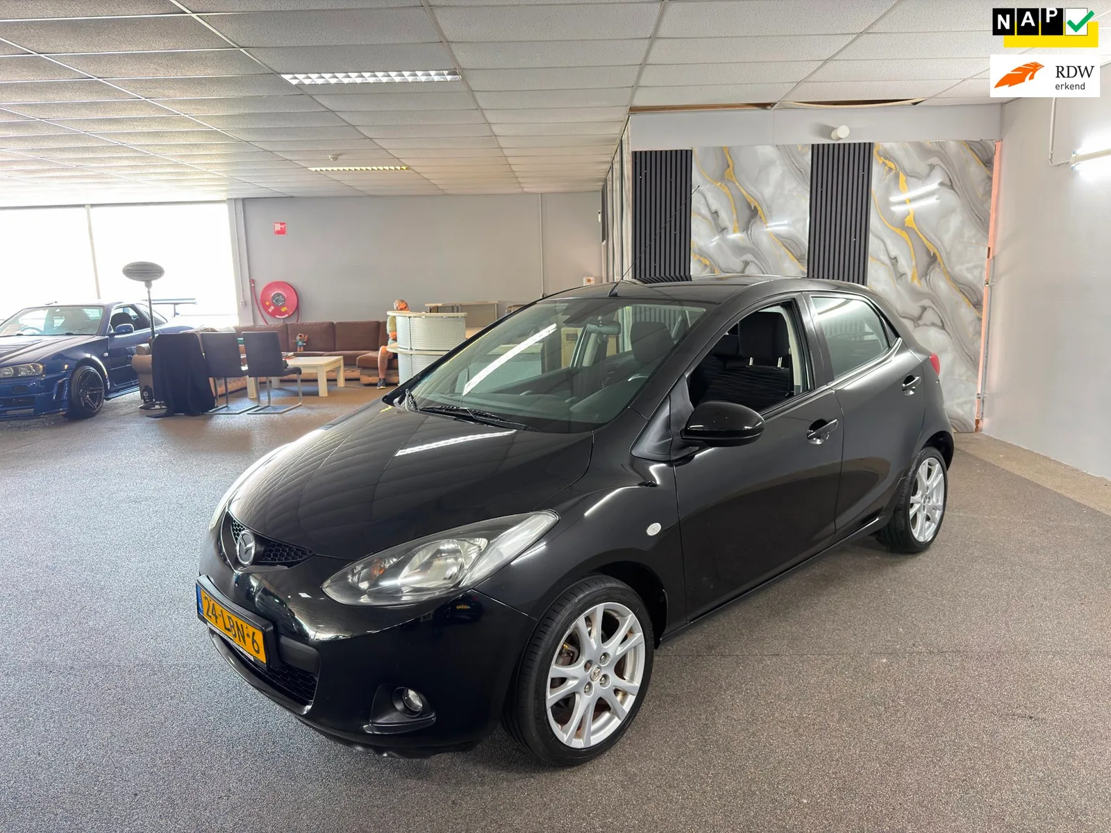 Mazda 2 (2010) — foto 1