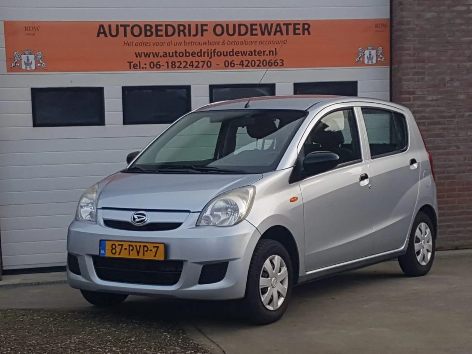 Daihatsu Cuore (2011) — foto 1