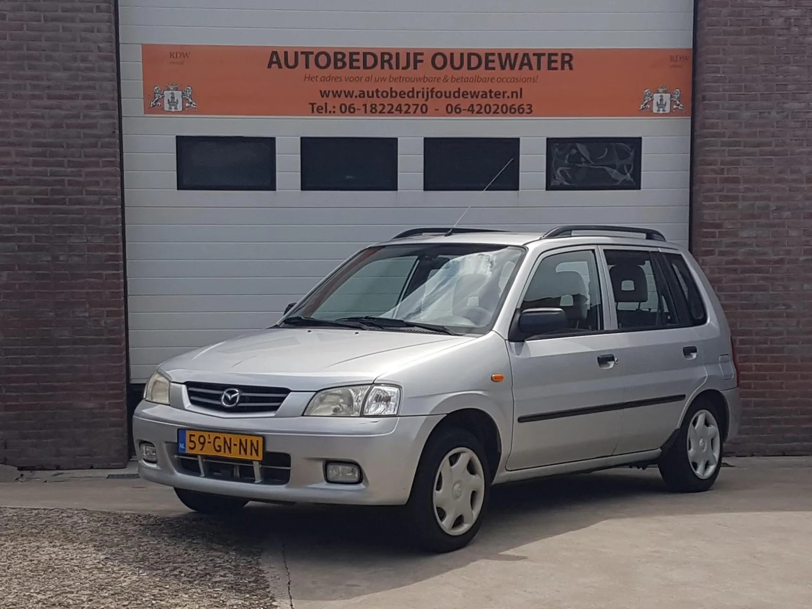 Mazda Demio (2001) — foto 1