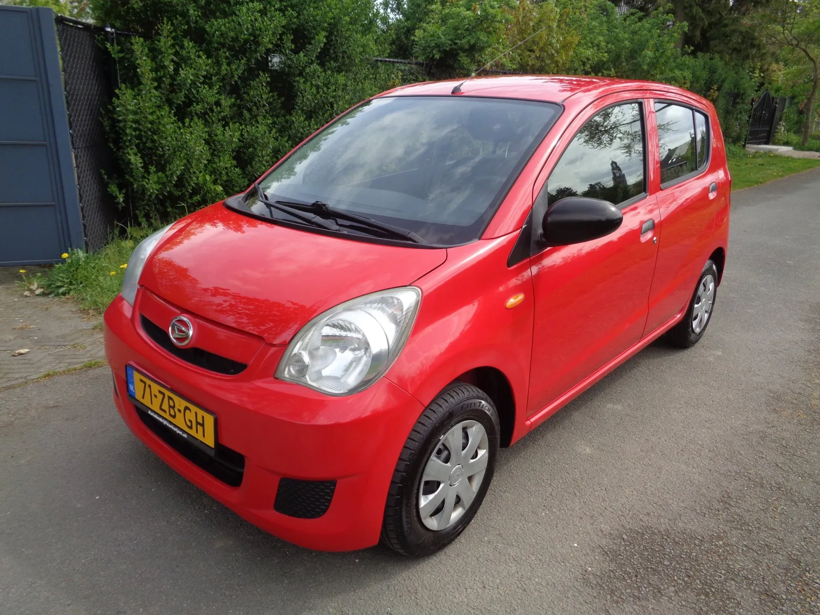 Daihatsu Cuore (2008) — foto 1