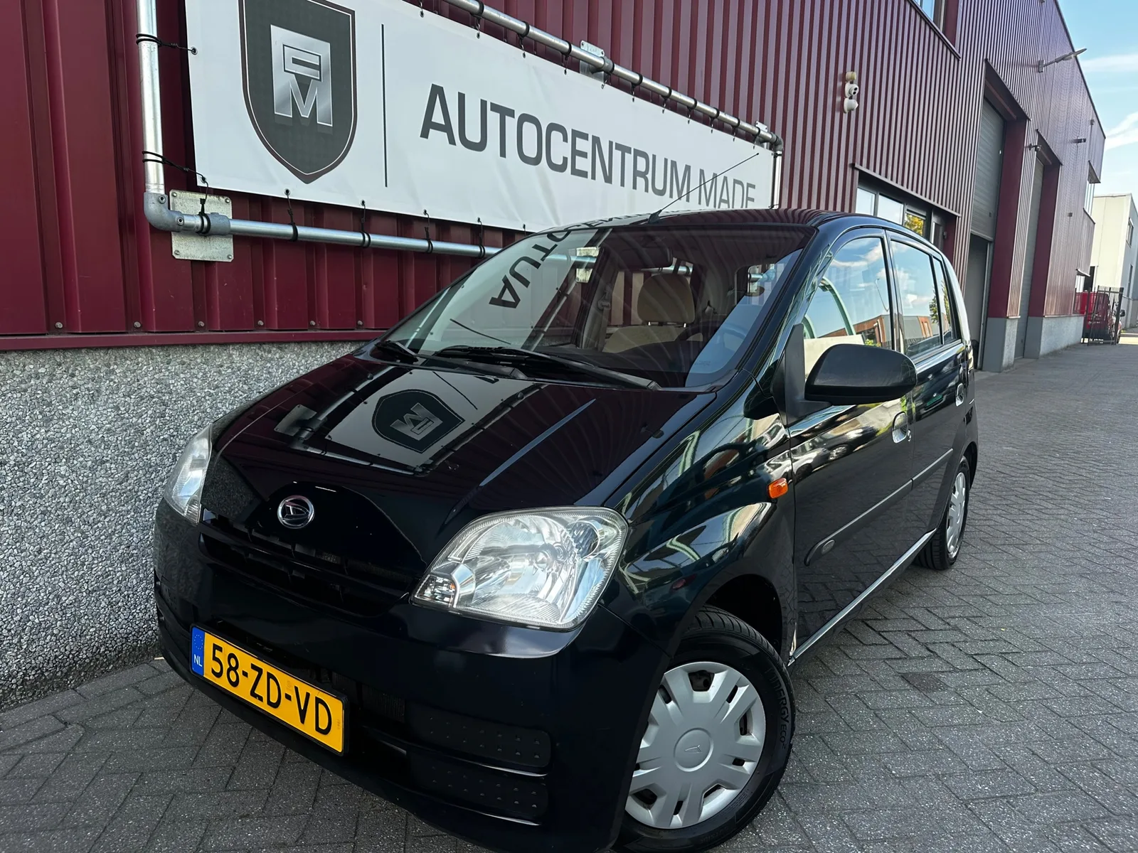 Daihatsu Cuore (2008) — foto 1