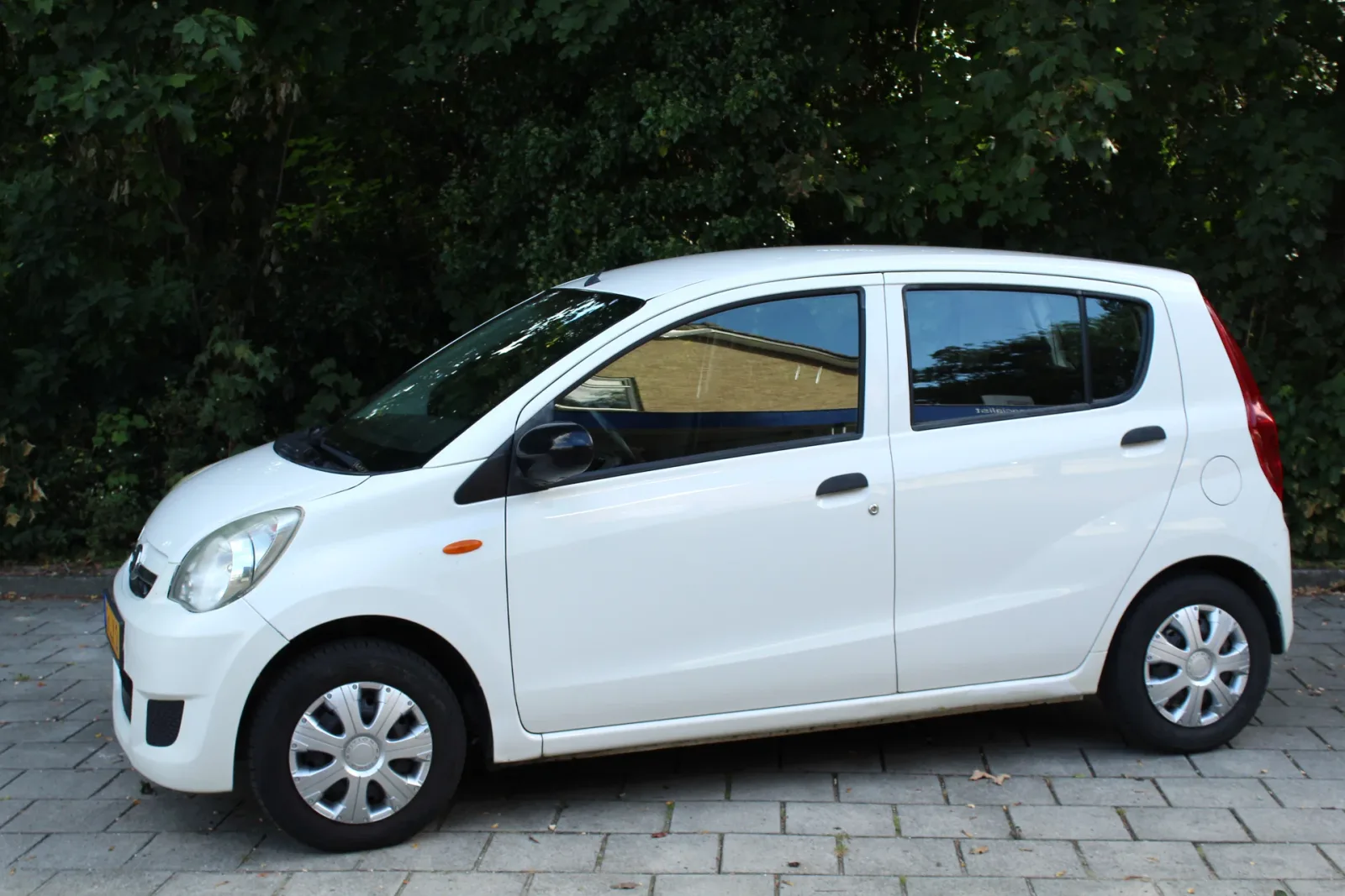Daihatsu Cuore (2011) — foto 1