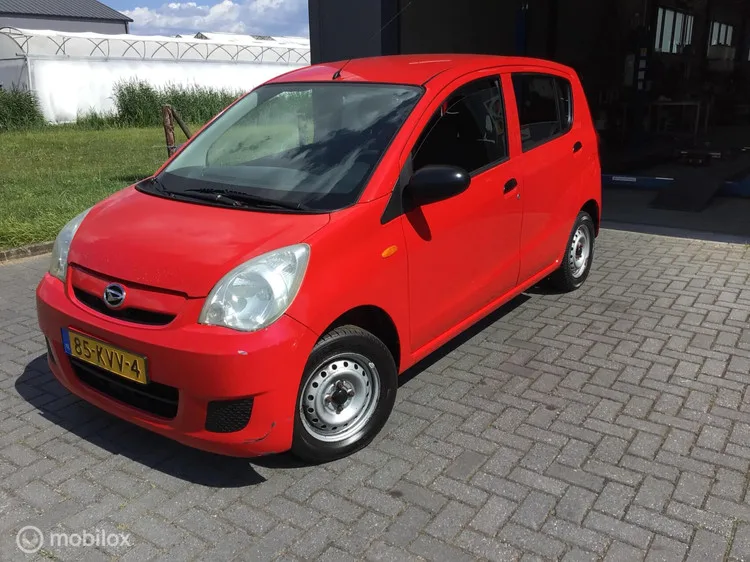 Daihatsu Cuore (2010) — foto 1