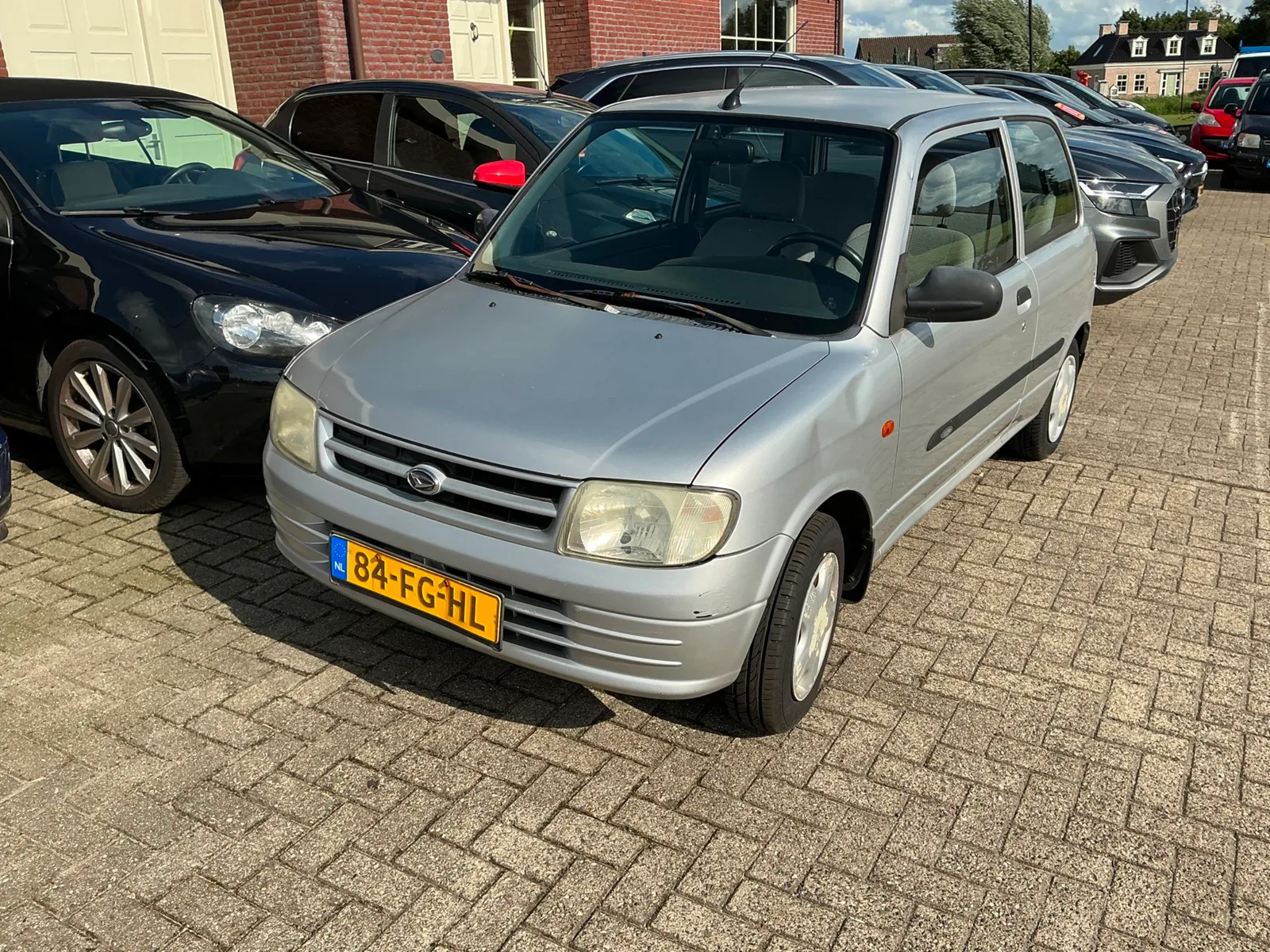 Daihatsu Cuore (2000) — foto 1