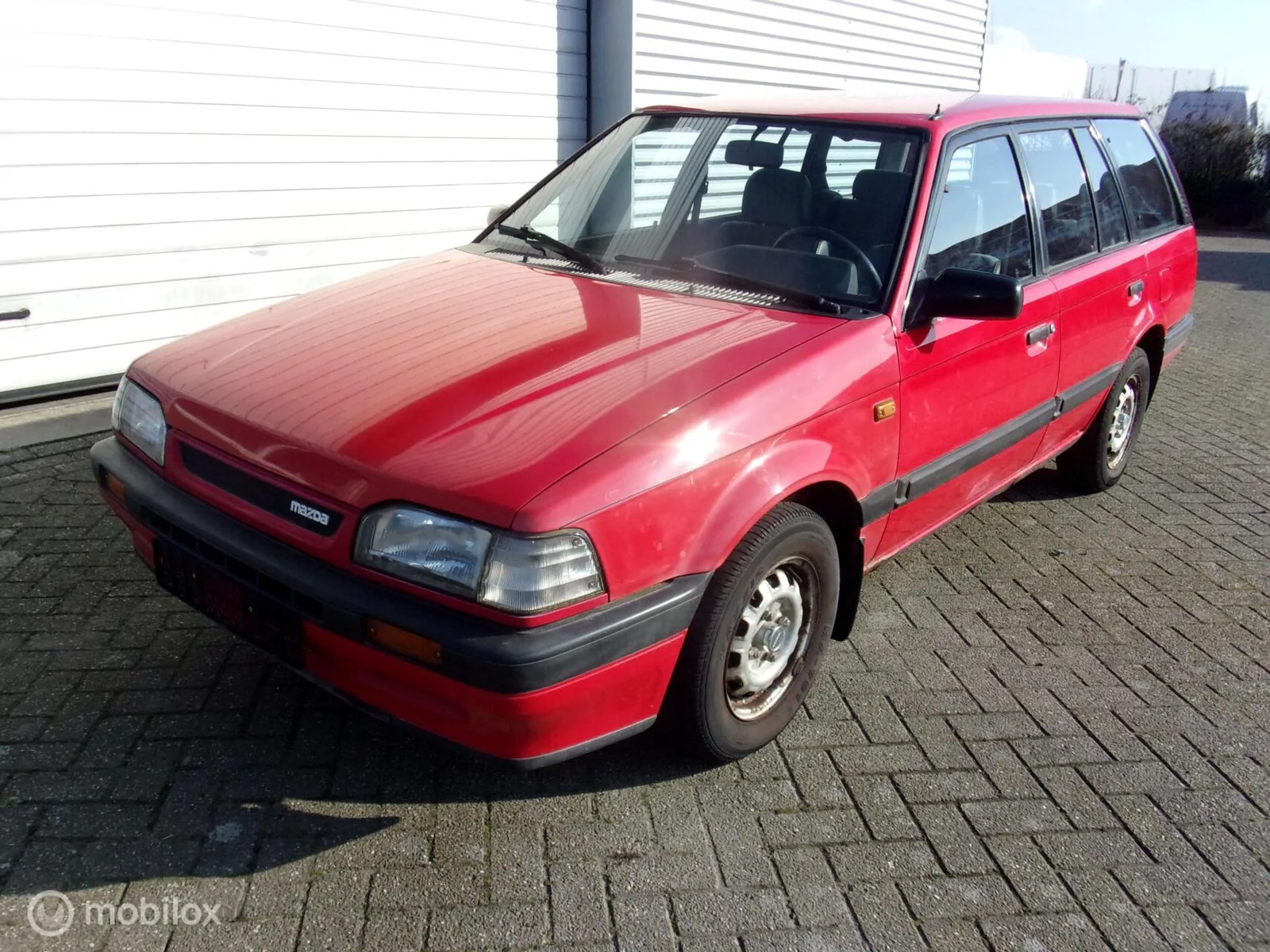 Mazda 323 (1992) — foto 1