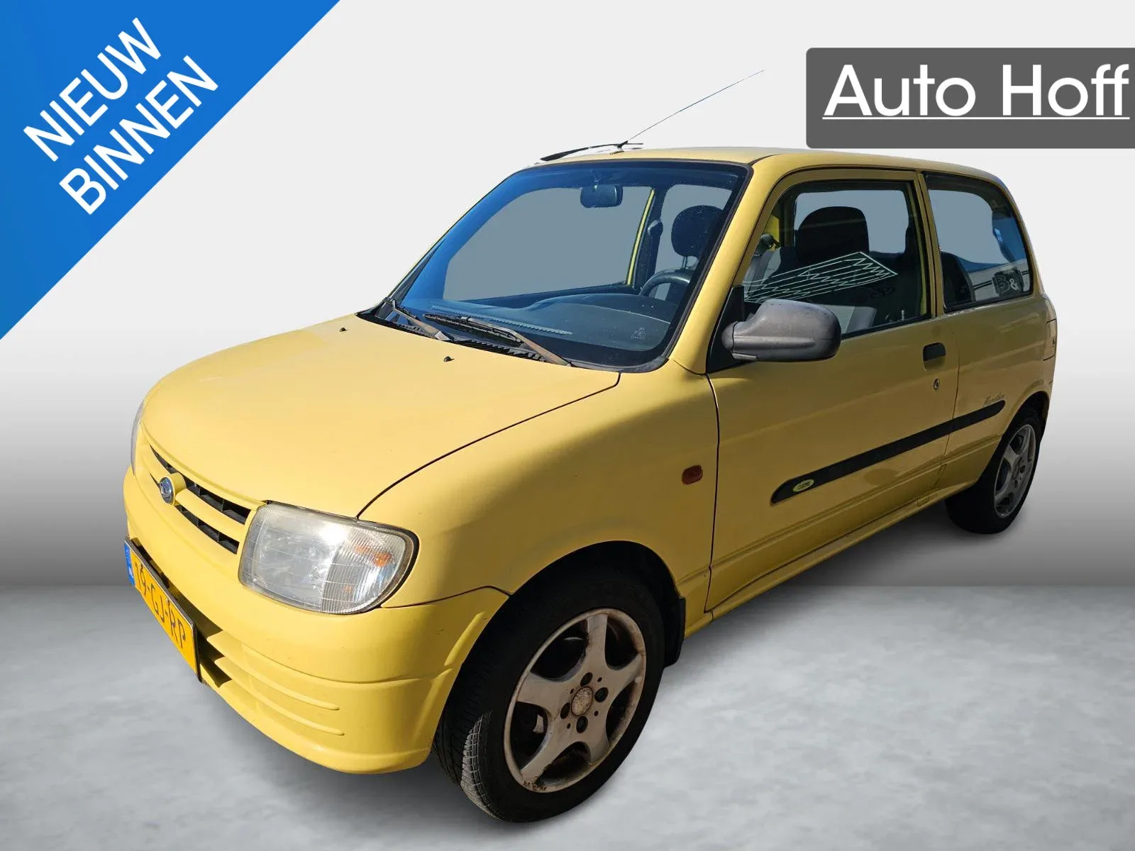 Daihatsu Cuore (2000) — foto 1