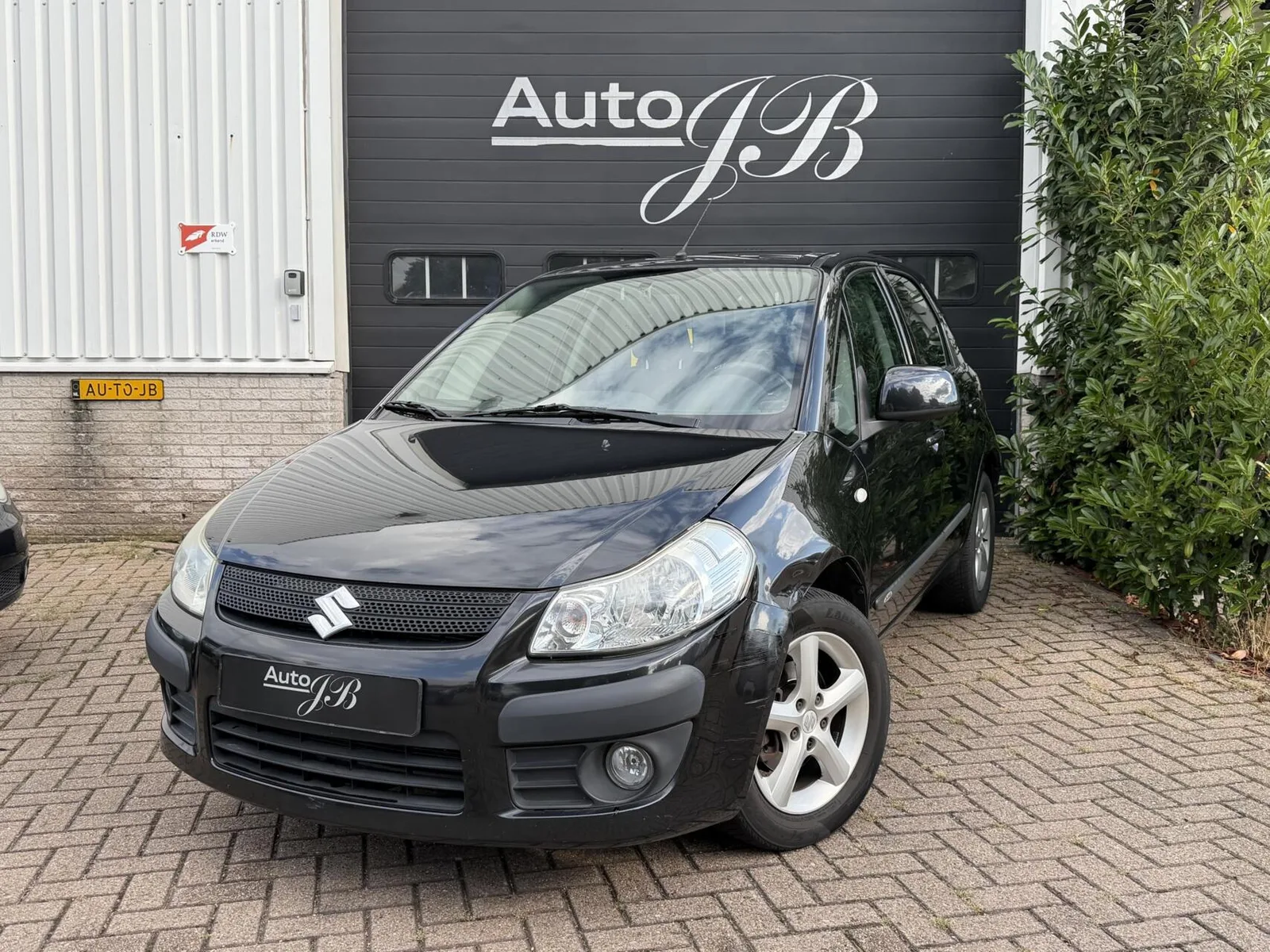 Suzuki SX4 (2006) — foto 1