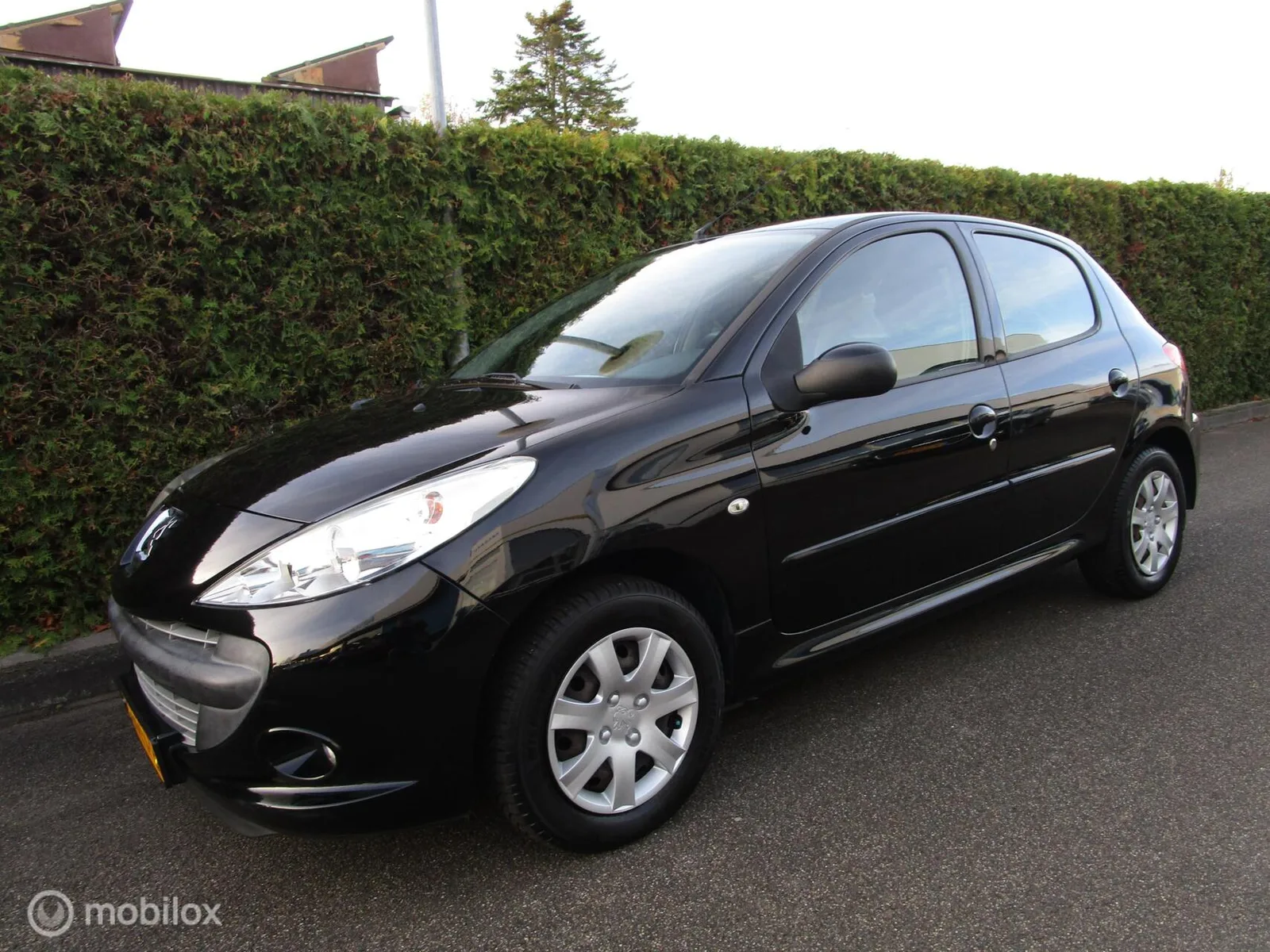 Peugeot 206 (2011) — foto 1