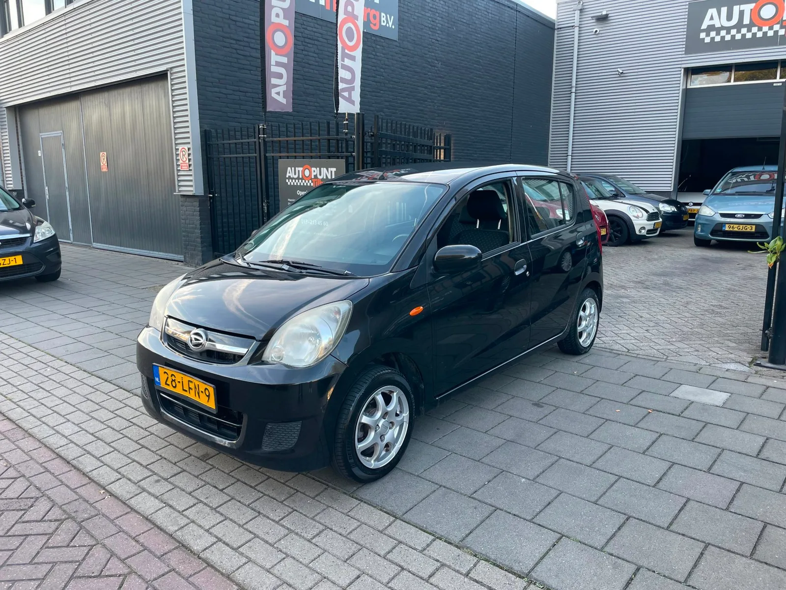 Daihatsu Cuore (2010) — foto 1