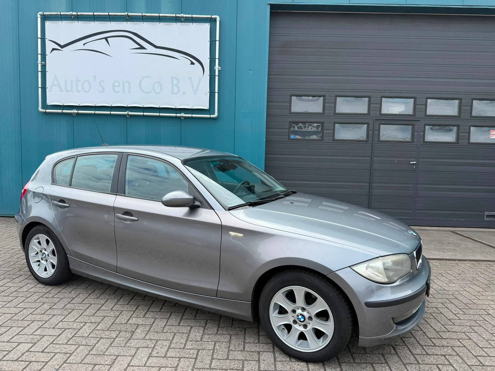 BMW 1-Serie (2009) — foto 1