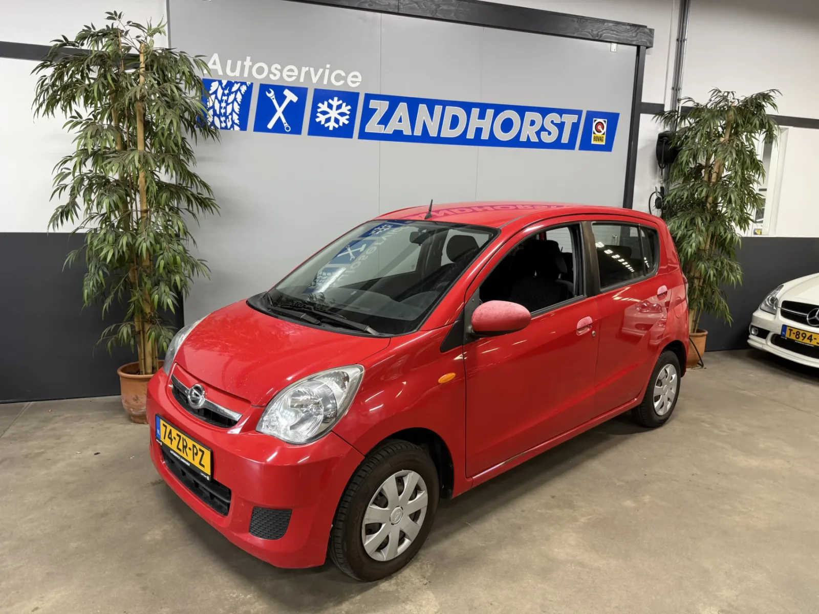 Daihatsu Cuore (2008) — foto 1