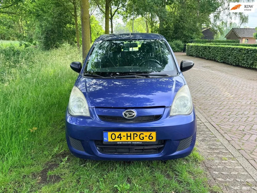 Daihatsu Cuore (2009) — foto 1
