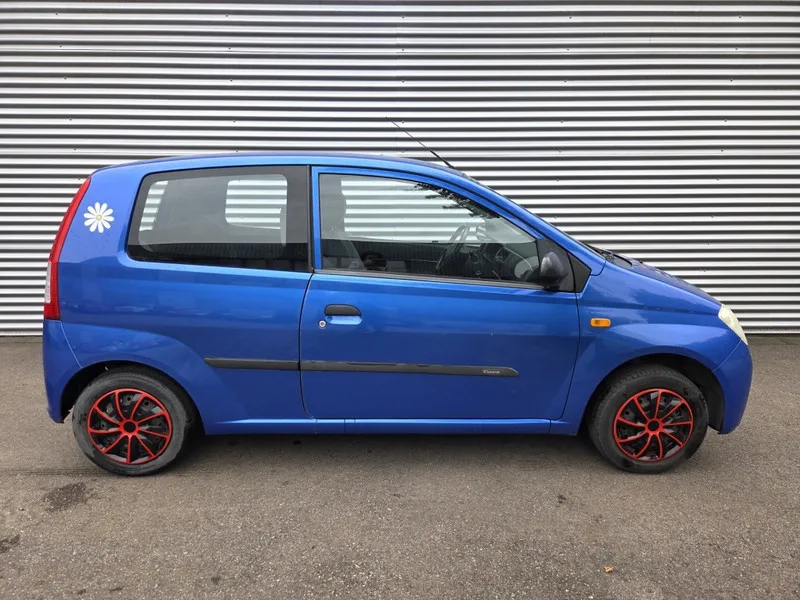 Daihatsu Cuore (2004) — foto 1