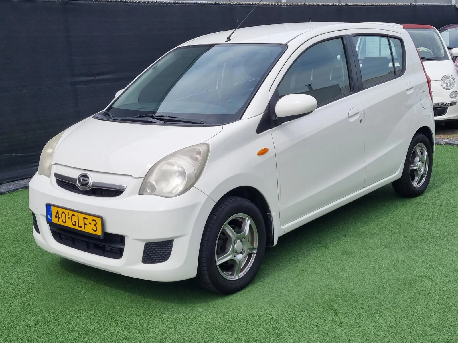 Daihatsu Cuore (2008) — foto 1