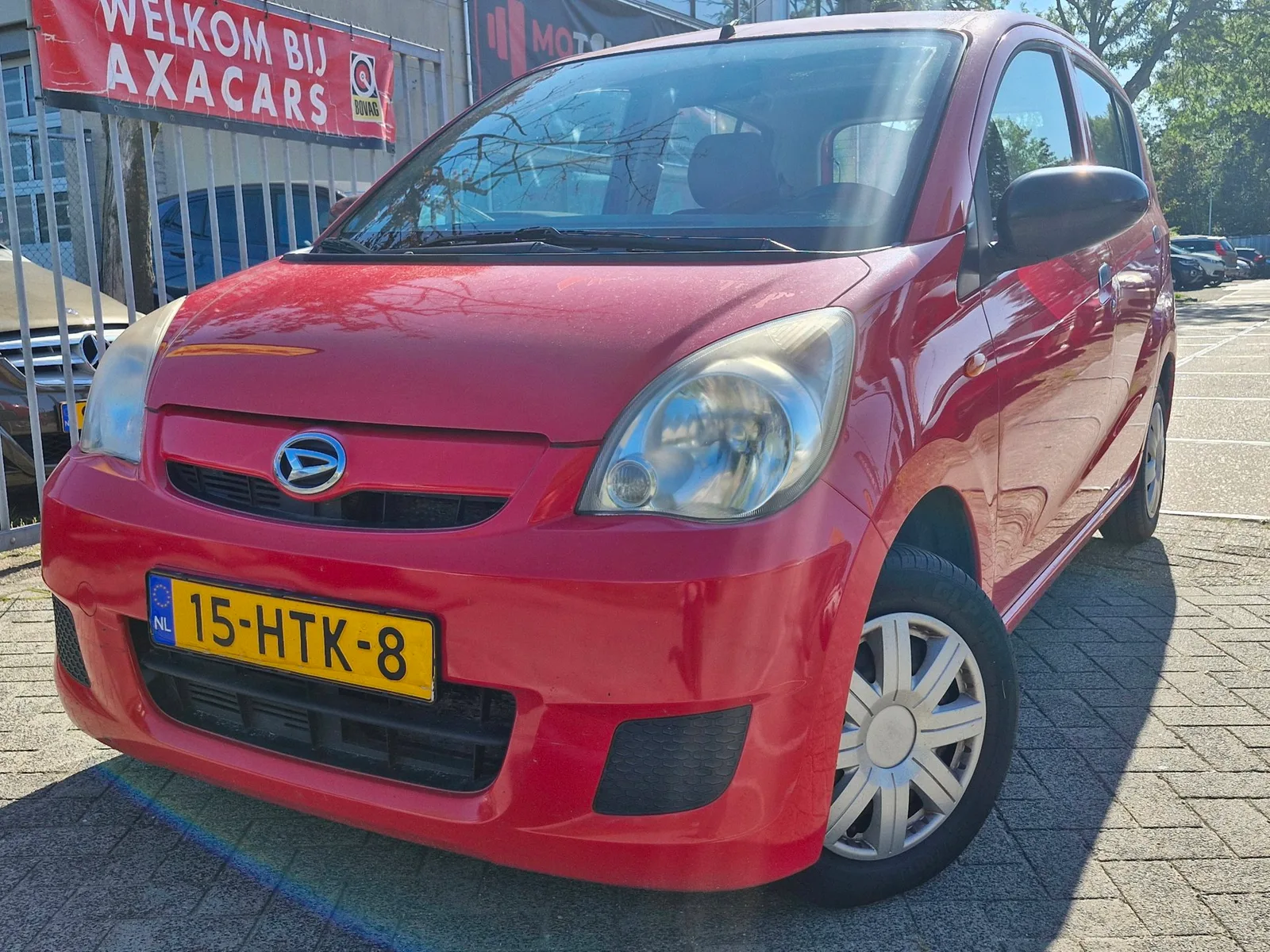 Daihatsu Cuore (2009) — foto 1