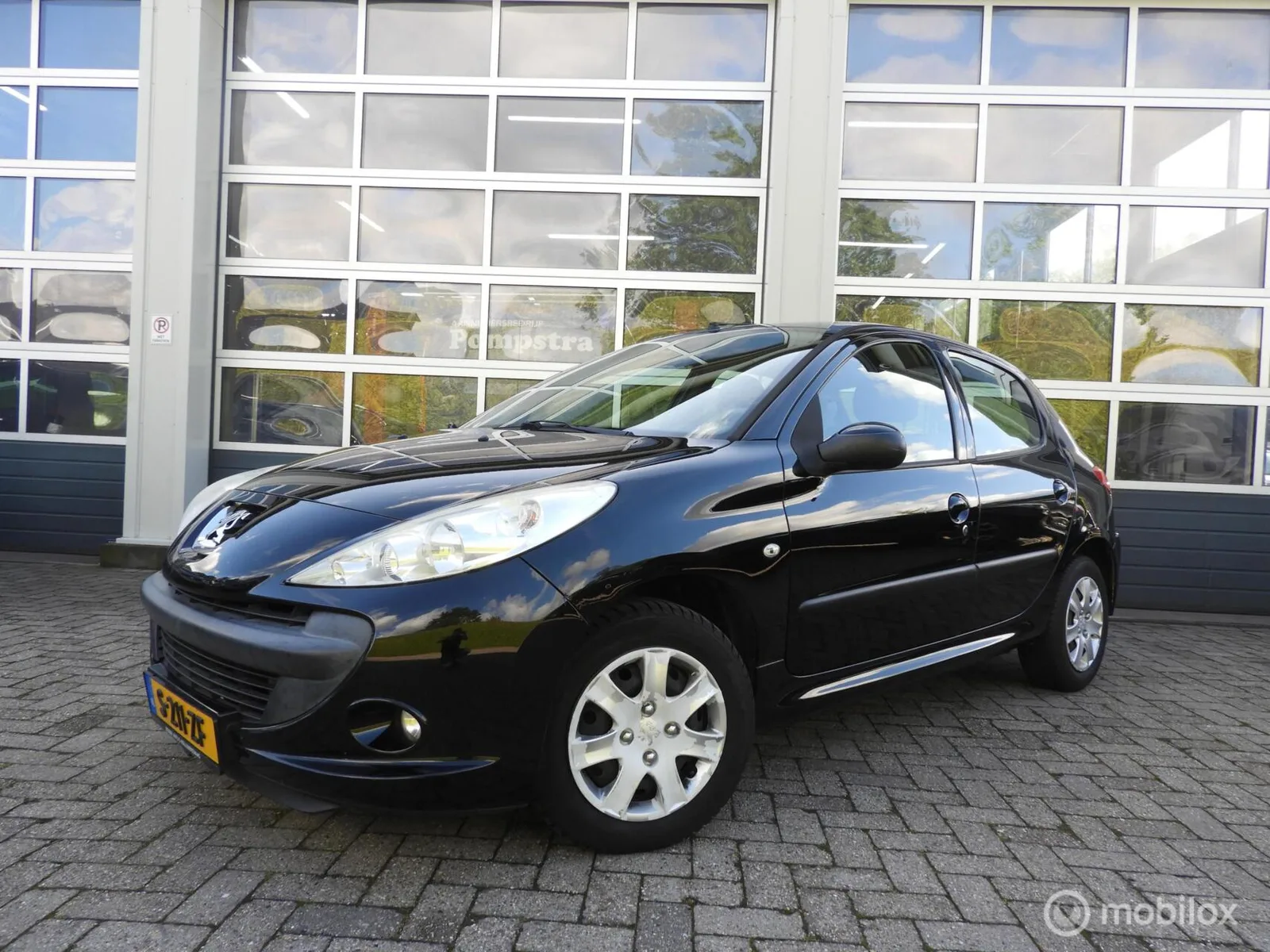 Peugeot 206 (2011) — foto 1