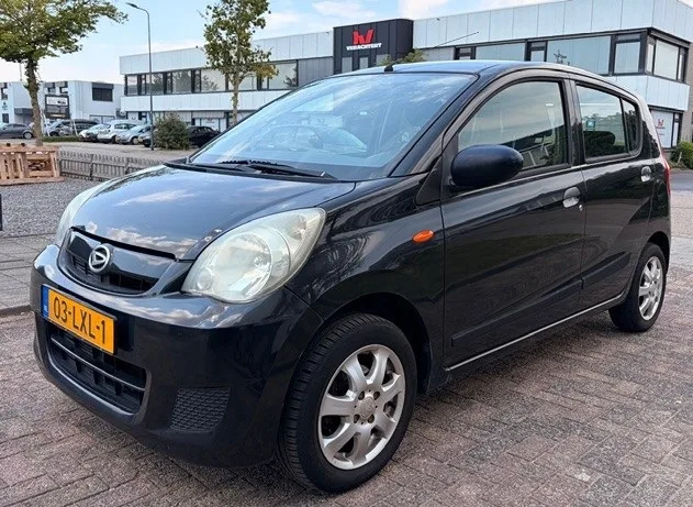 Daihatsu Cuore (2010) — foto 1