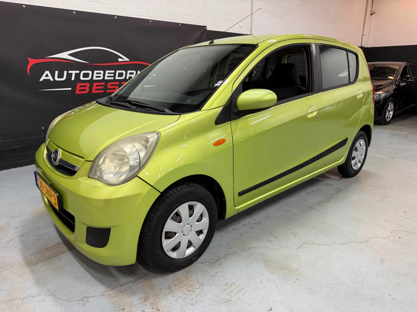 Daihatsu Cuore (2009) — foto 1