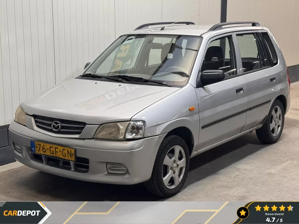 Mazda Demio (2000) — foto 1