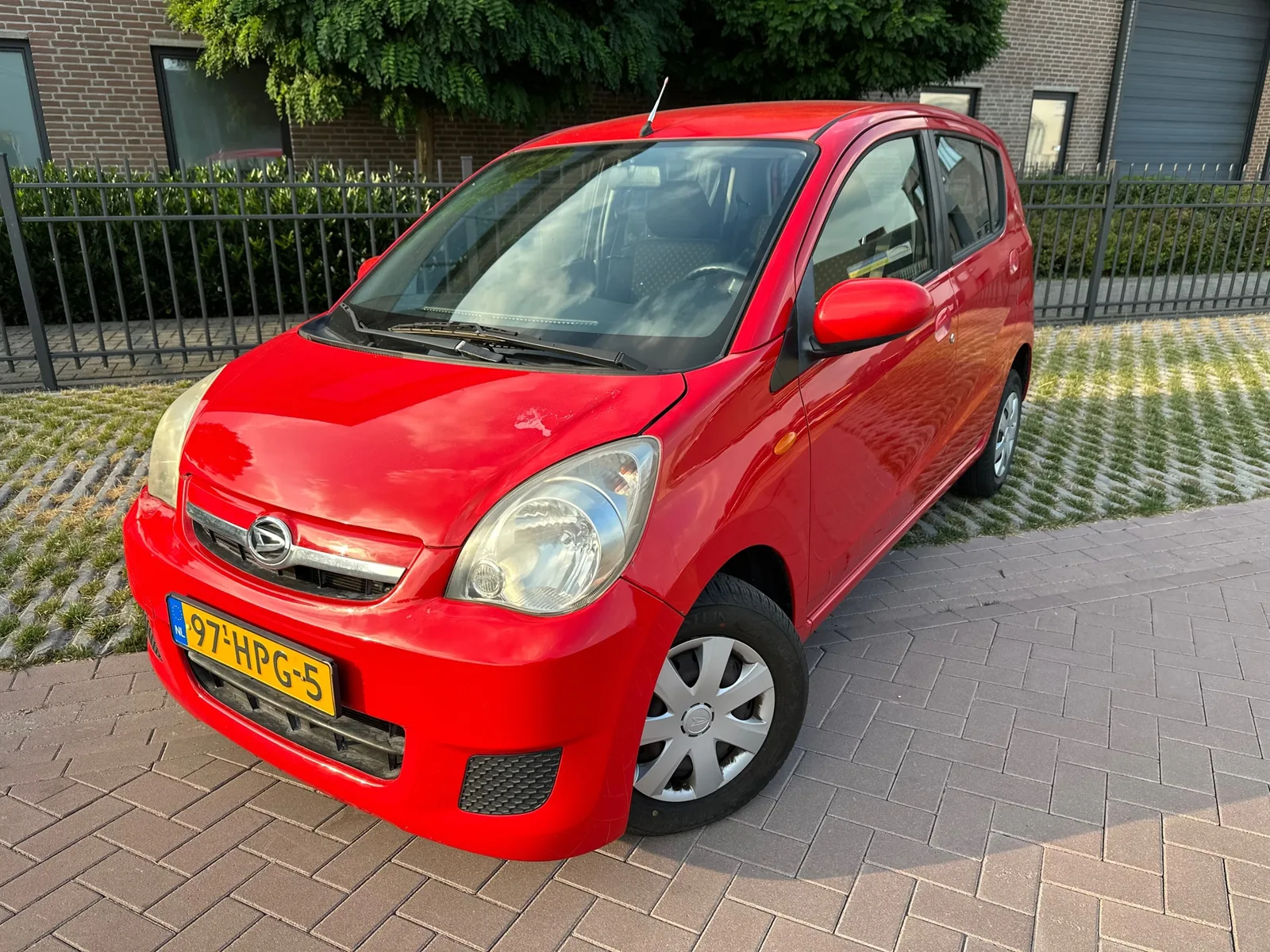 Daihatsu Cuore (2009) — foto 1