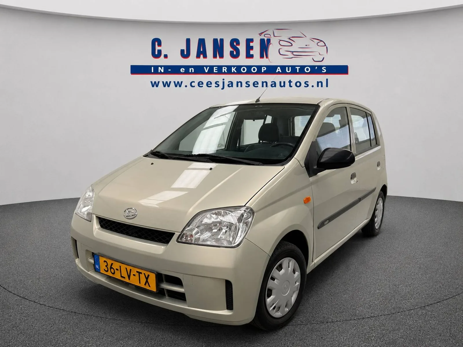 Daihatsu Cuore (2003) — foto 1