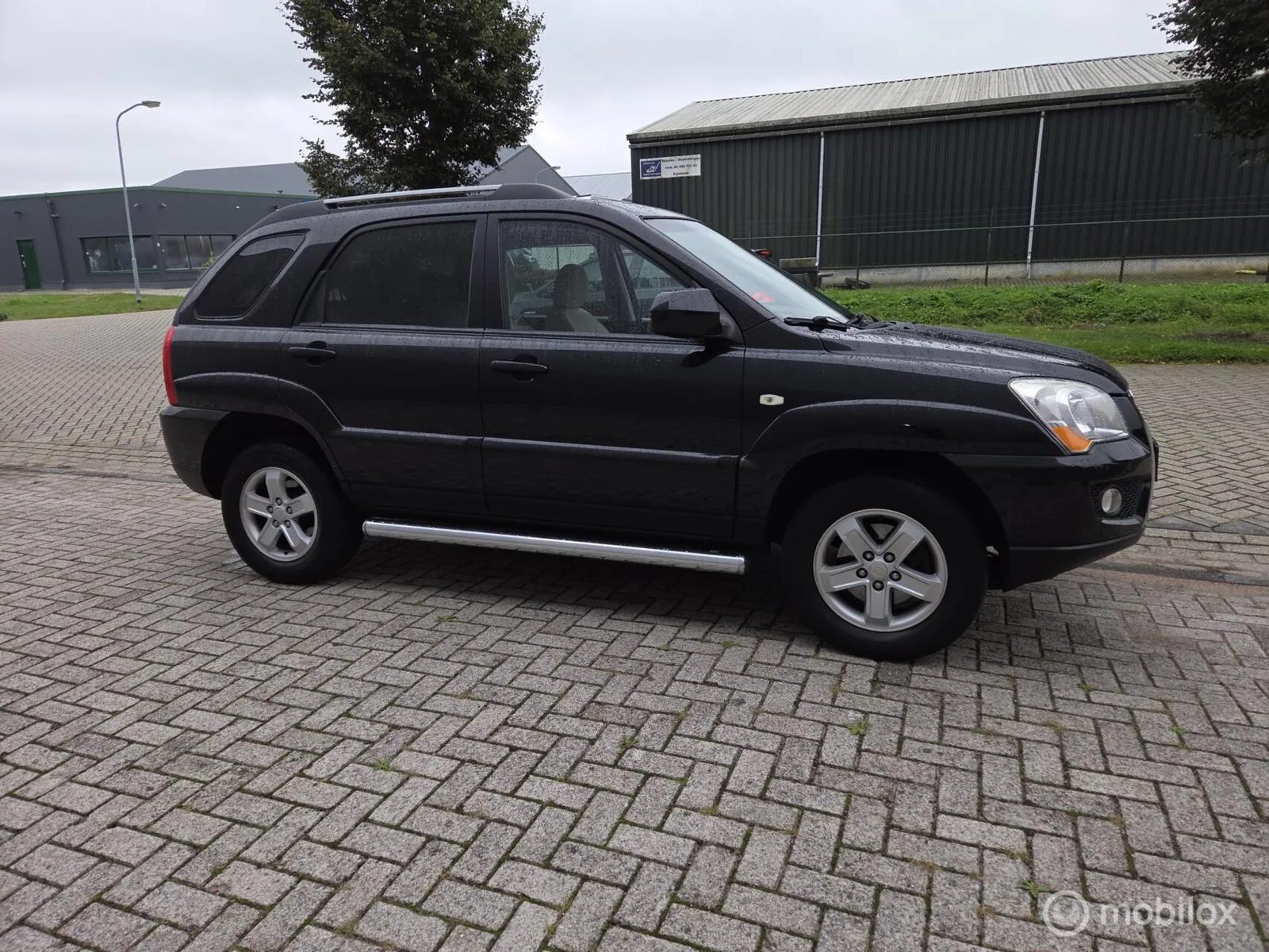 Kia Sportage (2008) — foto 1