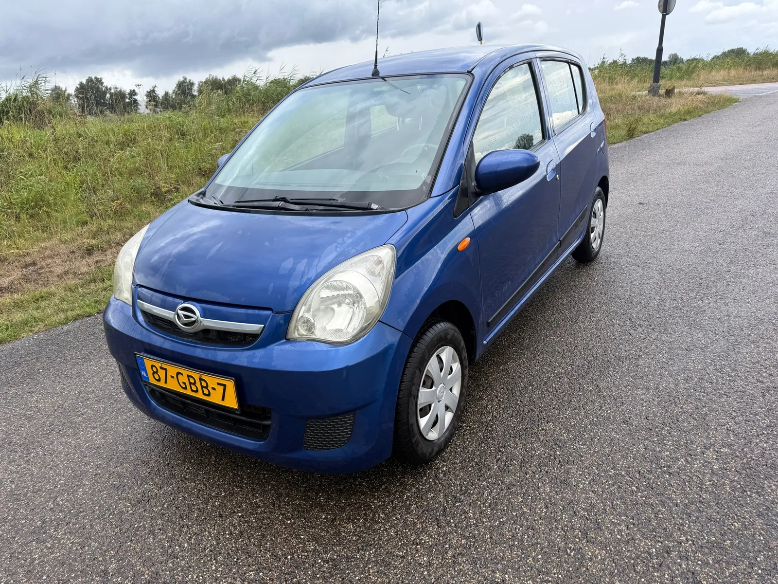 Daihatsu Cuore (2008) — foto 1