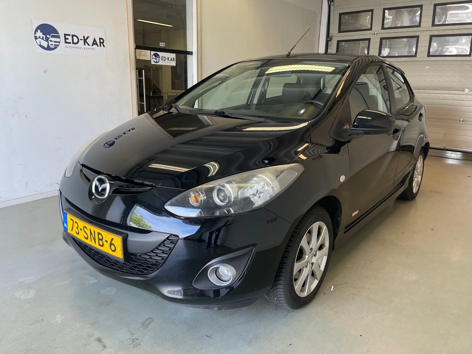 Mazda 2 (2011) — foto 1