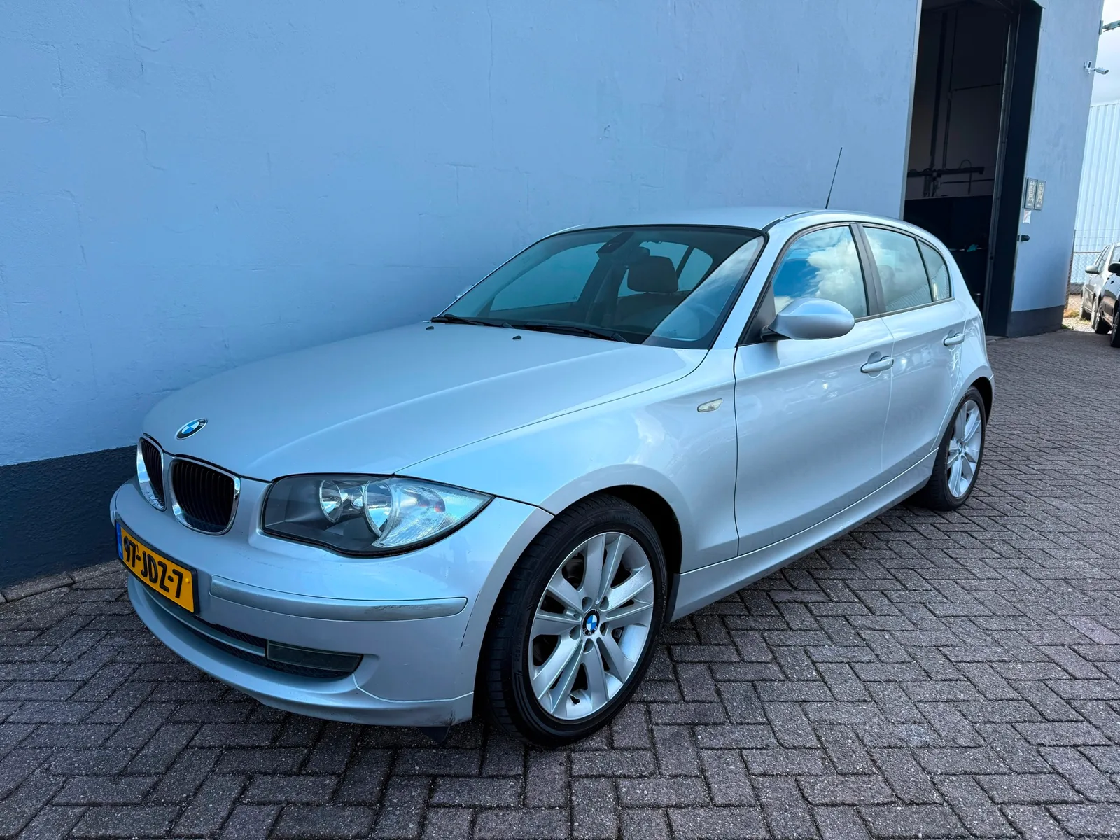 BMW 1-Serie (2009) — foto 1
