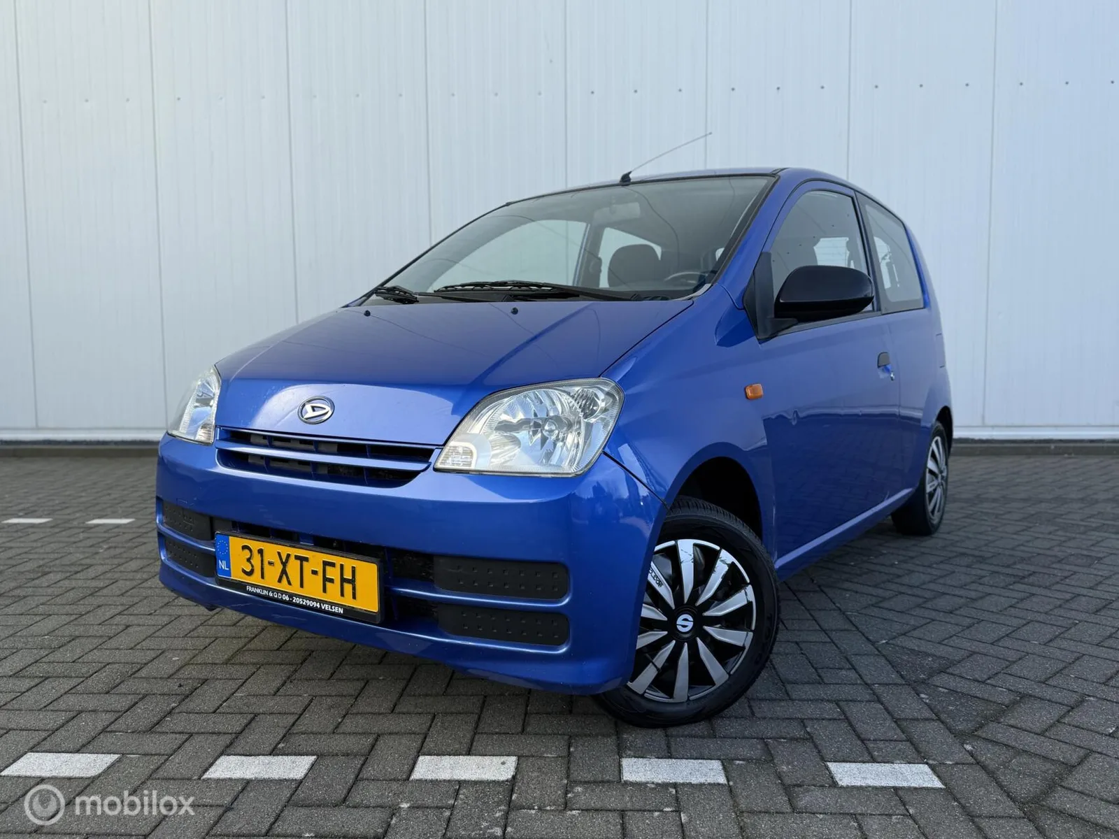 Daihatsu Cuore (2007) — foto 1