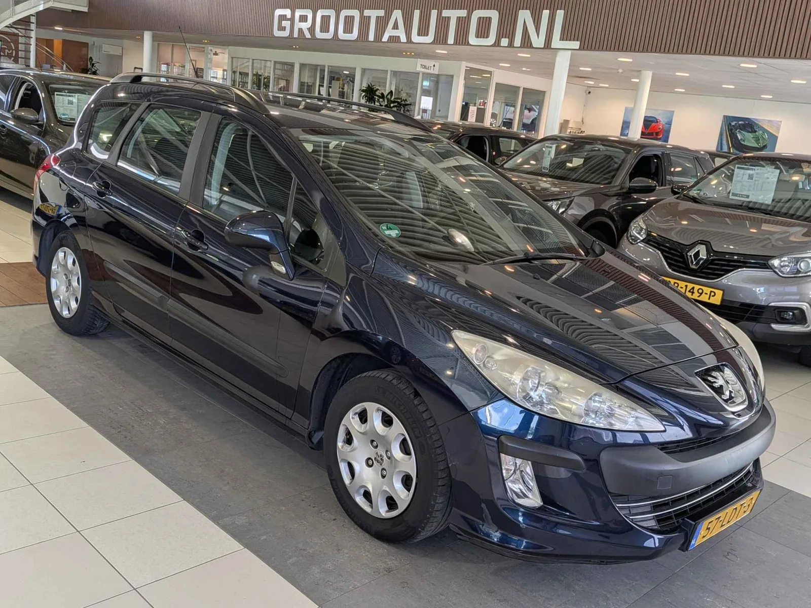 Peugeot 308 (2010) — foto 1