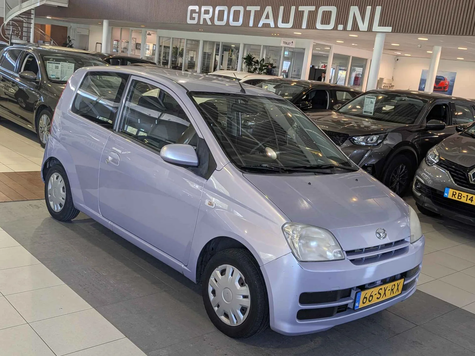 Daihatsu Cuore (2006) — foto 1