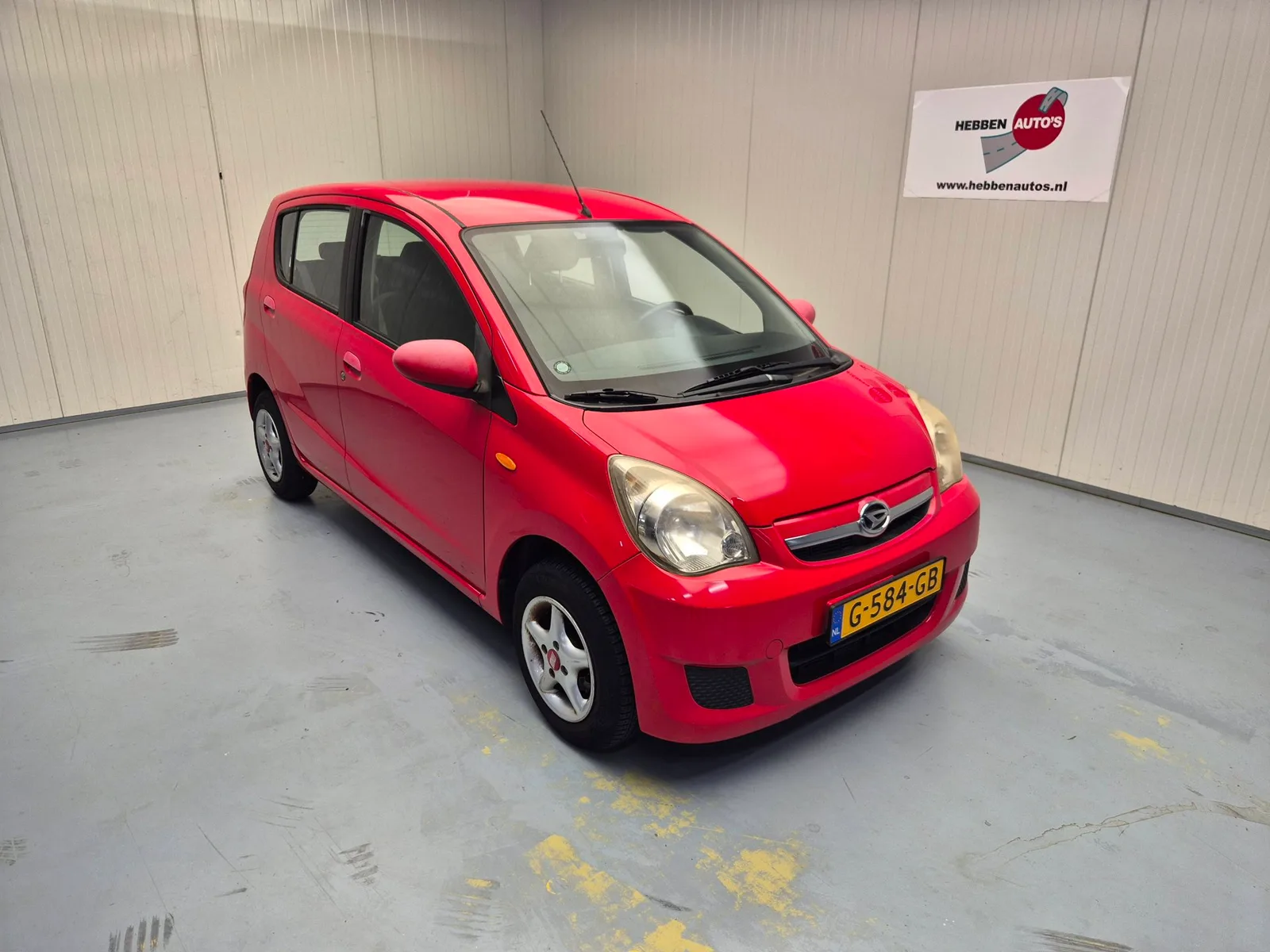 Daihatsu Cuore (2009) — foto 1