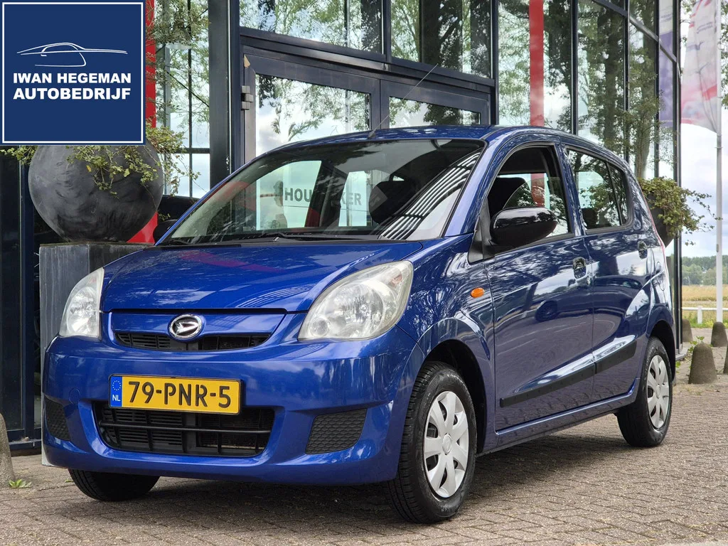 Daihatsu Cuore (2011) — foto 1