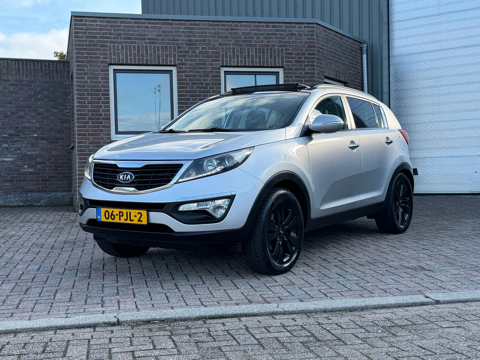 Kia Sportage (2011) — foto 1